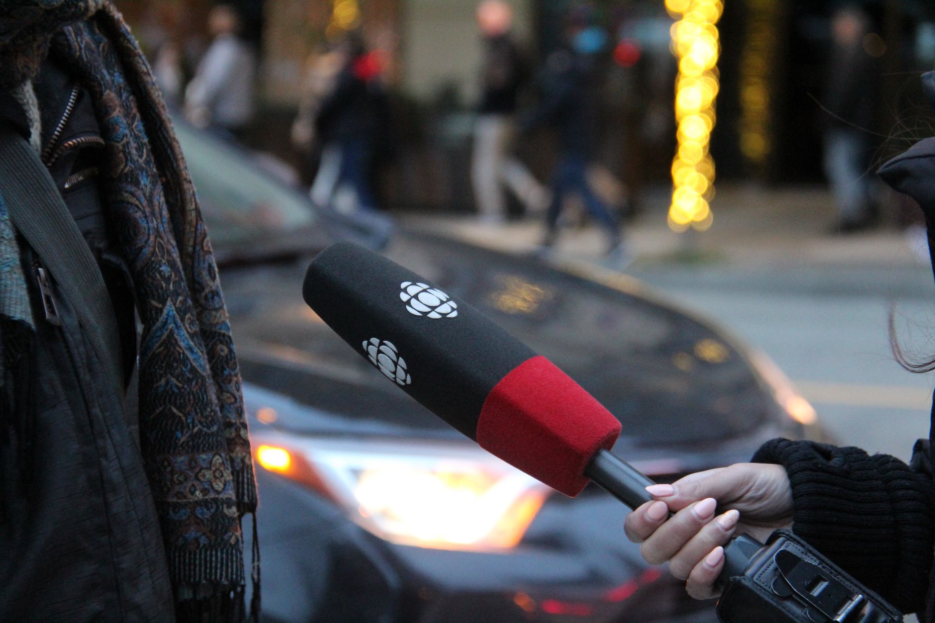 On the Ground reporter holding microphone